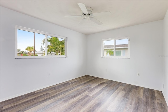 unfurnished room with hardwood / wood-style flooring, plenty of natural light, and ceiling fan