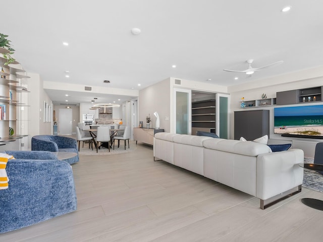 living room featuring ceiling fan