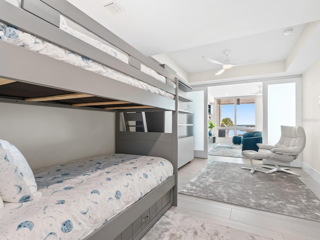 bedroom featuring a tray ceiling and ceiling fan