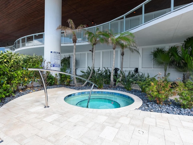 view of pool featuring a community hot tub