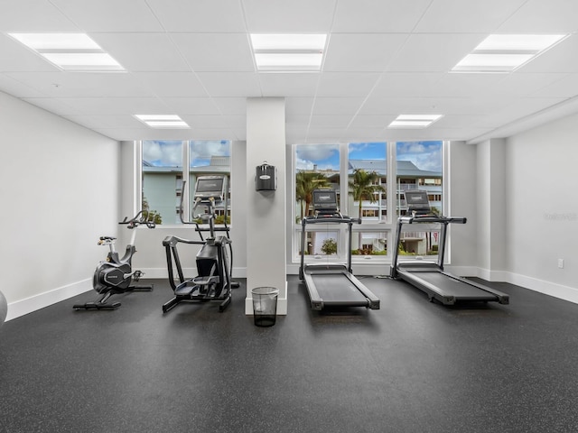 workout area featuring a paneled ceiling