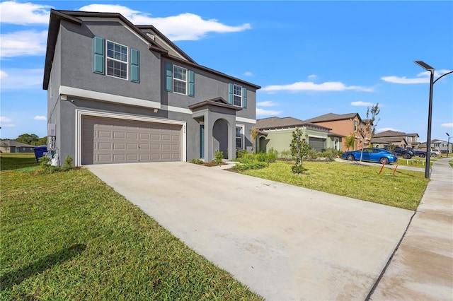 view of front of property featuring a garage and a front lawn