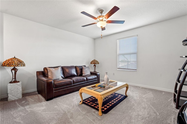 carpeted living room with ceiling fan