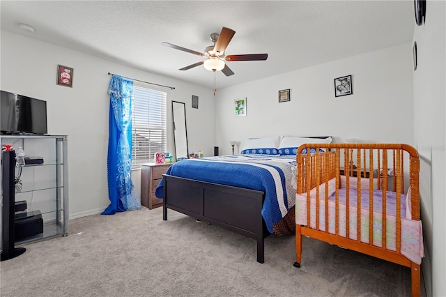 bedroom with light carpet and ceiling fan