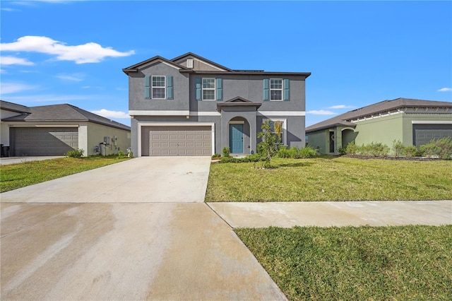 view of front facade featuring a garage and a front lawn