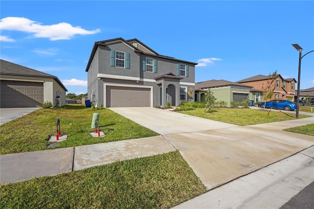 view of front of home featuring a front yard and a garage