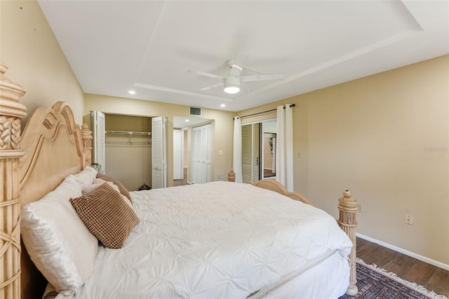 bedroom with wood-type flooring, a closet, and ceiling fan