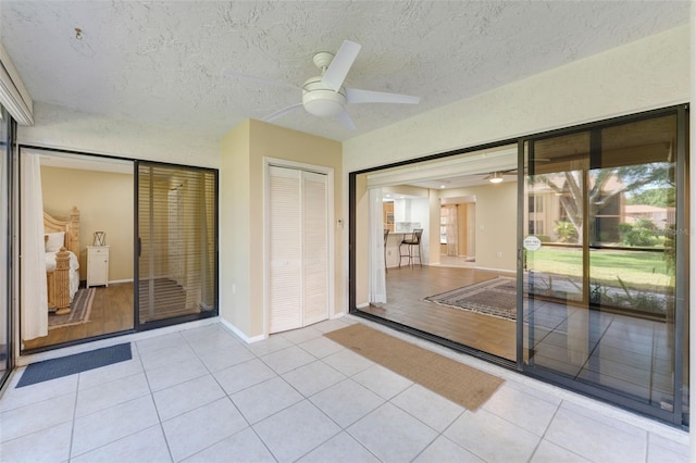 interior space featuring ceiling fan