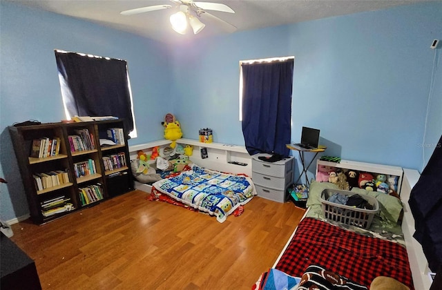 bedroom featuring ceiling fan and wood-type flooring