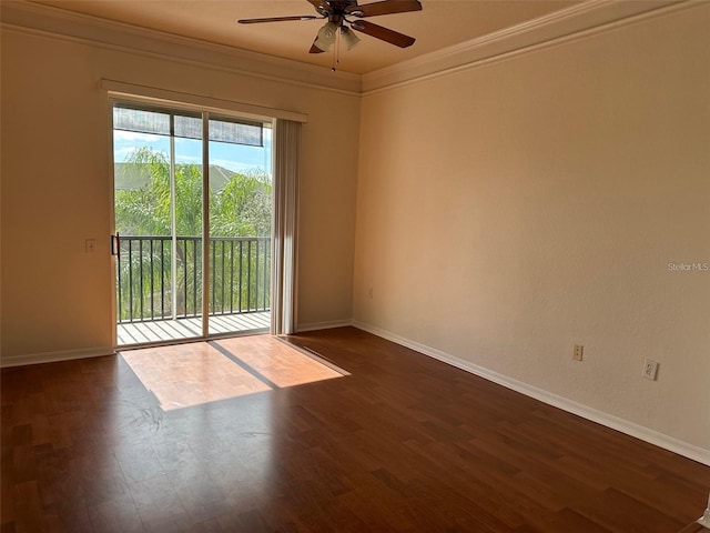 spare room with dark hardwood / wood-style floors, ceiling fan, and crown molding