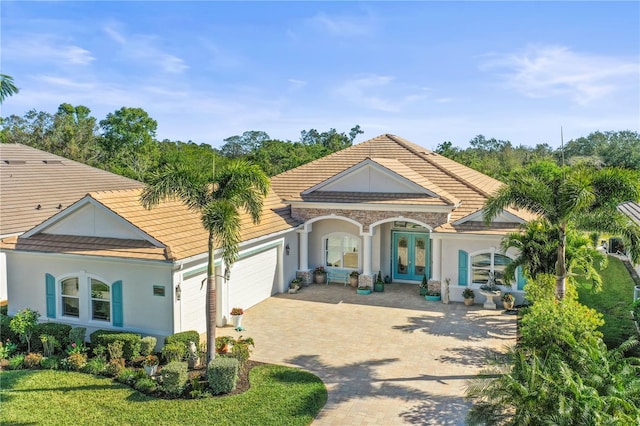 view of front of house with french doors and a garage