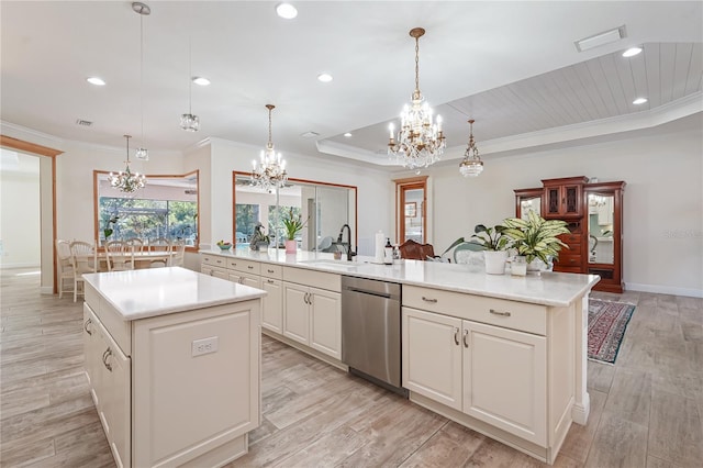 kitchen with kitchen peninsula, dishwasher, a kitchen island, and decorative light fixtures