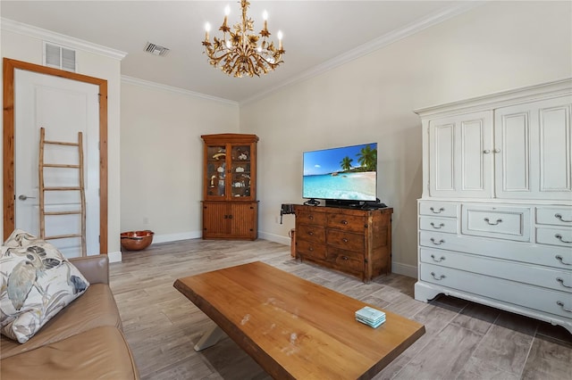 living room featuring light hardwood / wood-style floors, crown molding, and a notable chandelier