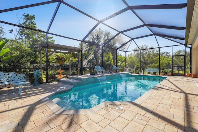 view of pool featuring pool water feature, glass enclosure, and a patio