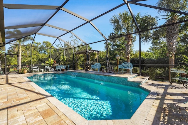 view of swimming pool featuring pool water feature, a lanai, and a patio