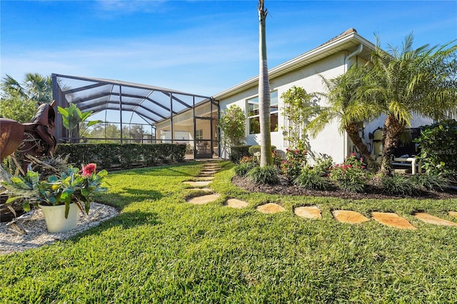 view of yard featuring glass enclosure