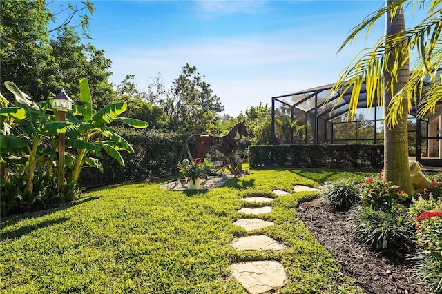 view of yard featuring glass enclosure