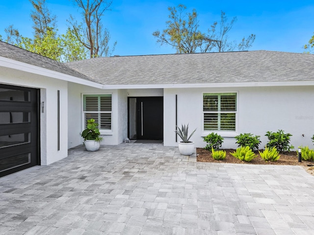 property entrance with a garage