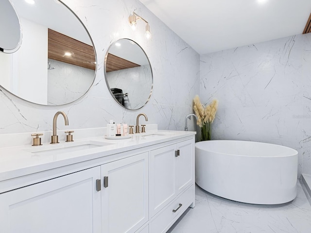 bathroom featuring vanity and a tub to relax in