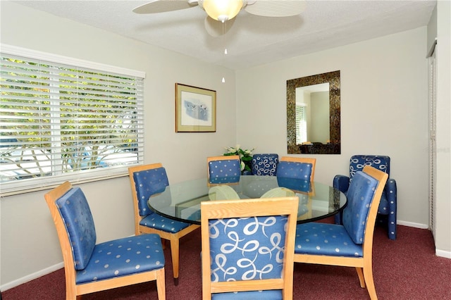 dining space featuring carpet flooring, ceiling fan, and a textured ceiling