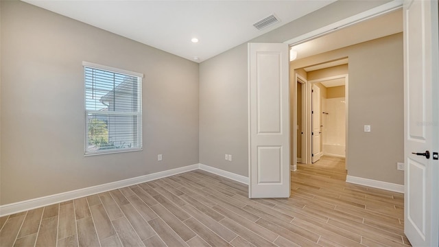 unfurnished room featuring light wood-type flooring