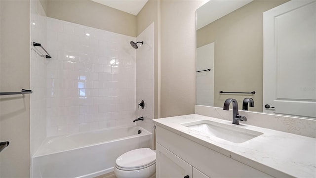 full bathroom featuring vanity, toilet, and tiled shower / bath