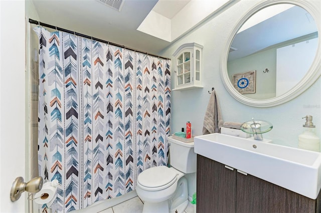 bathroom with tile patterned flooring, vanity, toilet, and a shower with curtain