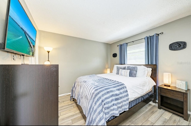 bedroom featuring light wood-type flooring