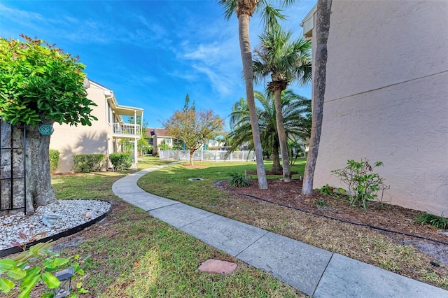 view of yard featuring a balcony