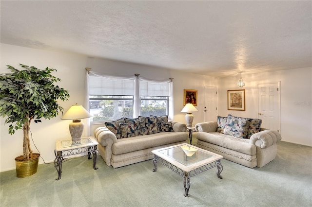 living room featuring carpet flooring and a textured ceiling