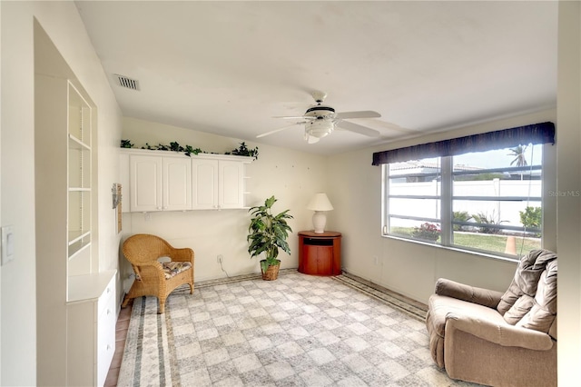 living area featuring ceiling fan