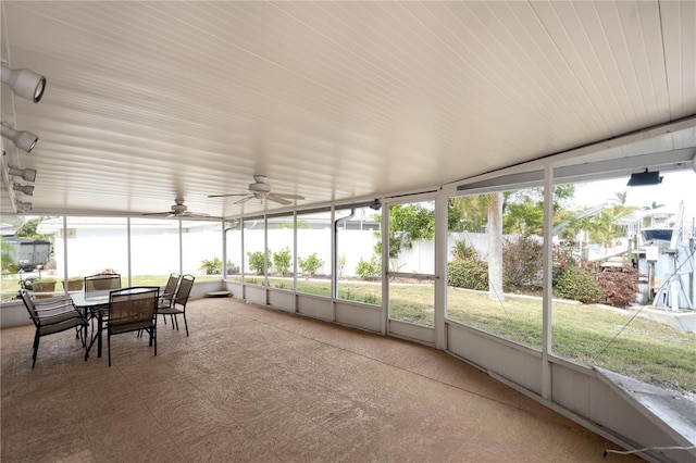 sunroom with a wealth of natural light and ceiling fan