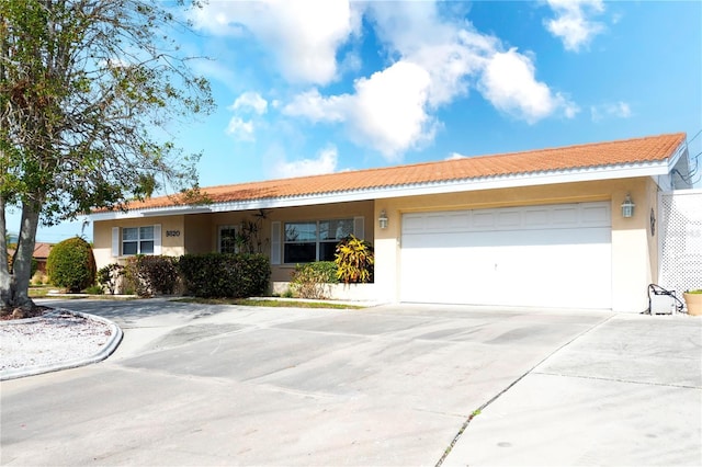 single story home featuring a garage