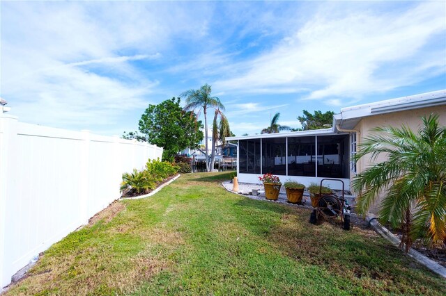 view of yard featuring a sunroom