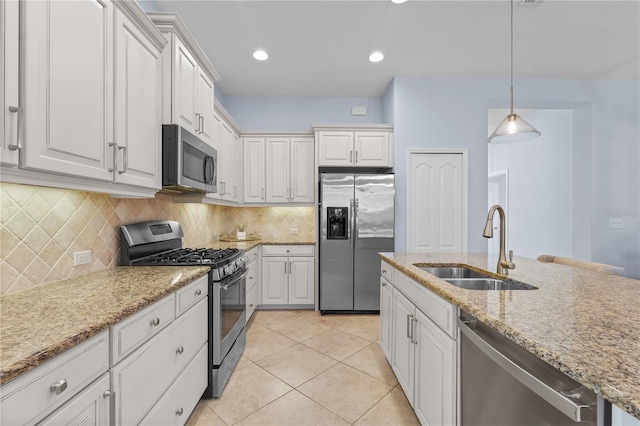 kitchen with white cabinets, sink, light tile patterned floors, and stainless steel appliances