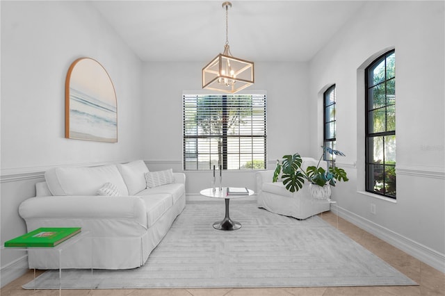 living room with light tile patterned flooring and a chandelier