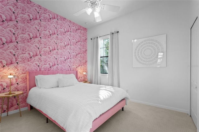 bedroom with ceiling fan and carpet floors