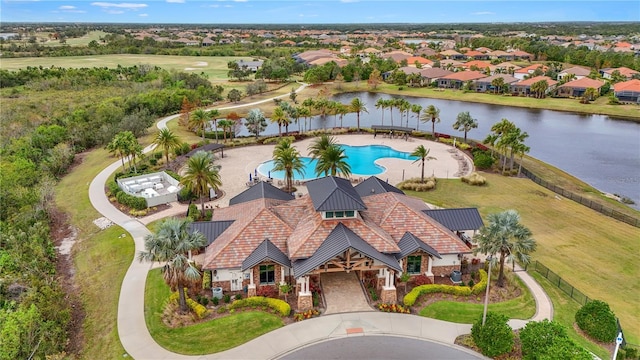 birds eye view of property featuring a water view