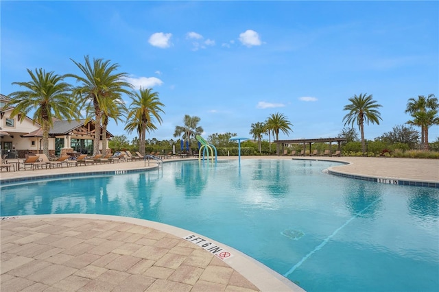 view of swimming pool with a patio area