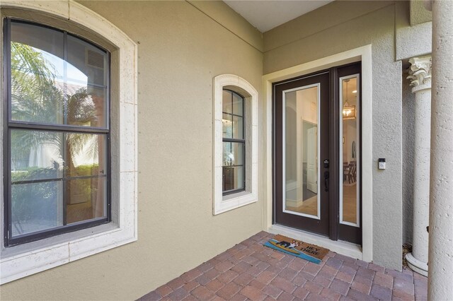 entrance to property with stucco siding