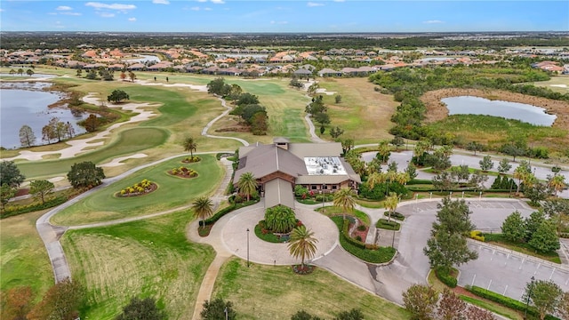 drone / aerial view featuring a water view and golf course view