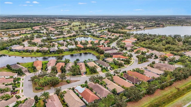 aerial view featuring a water view and a residential view