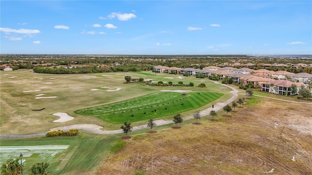 aerial view with a residential view and view of golf course