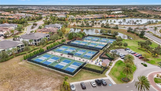 birds eye view of property featuring a residential view and a water view