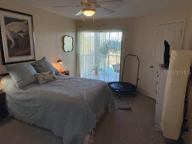 bedroom with access to outside and ceiling fan