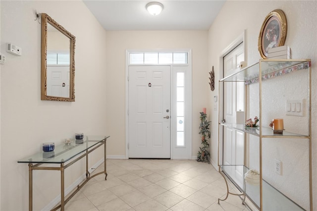 foyer featuring light tile patterned floors