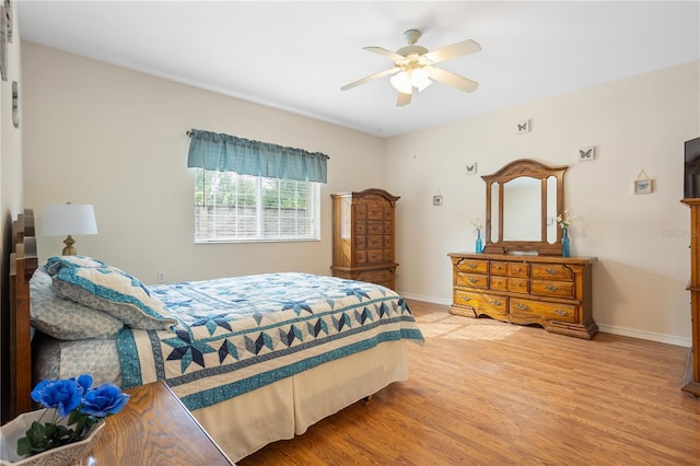 bedroom featuring hardwood / wood-style floors and ceiling fan