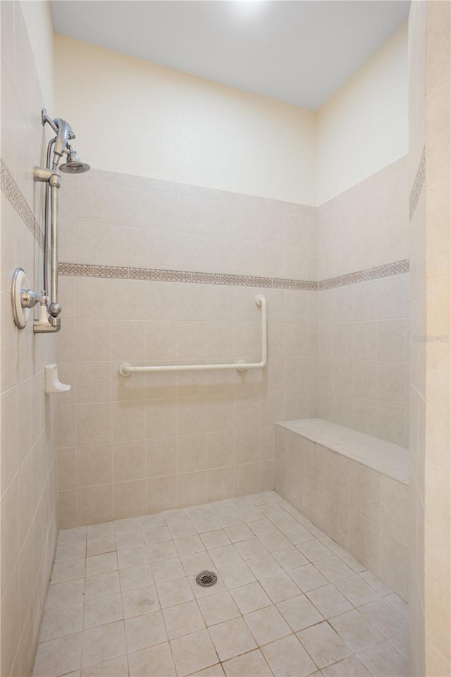 bathroom with a tile shower