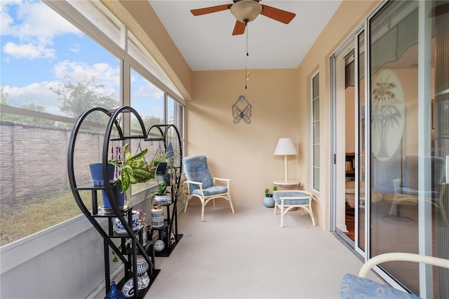 sunroom / solarium with ceiling fan and plenty of natural light