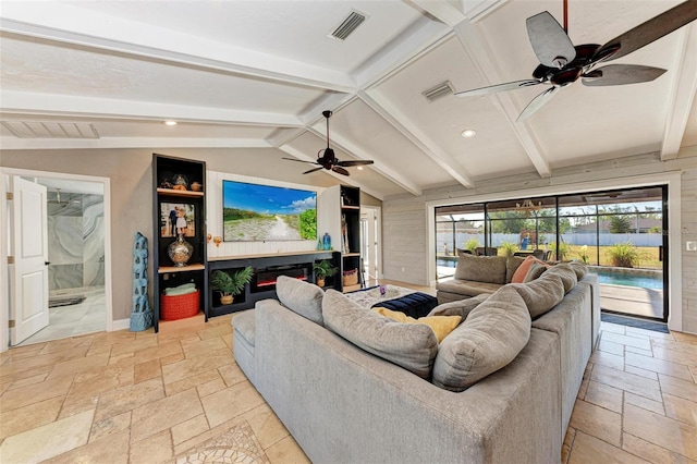 living room featuring lofted ceiling with beams and ceiling fan